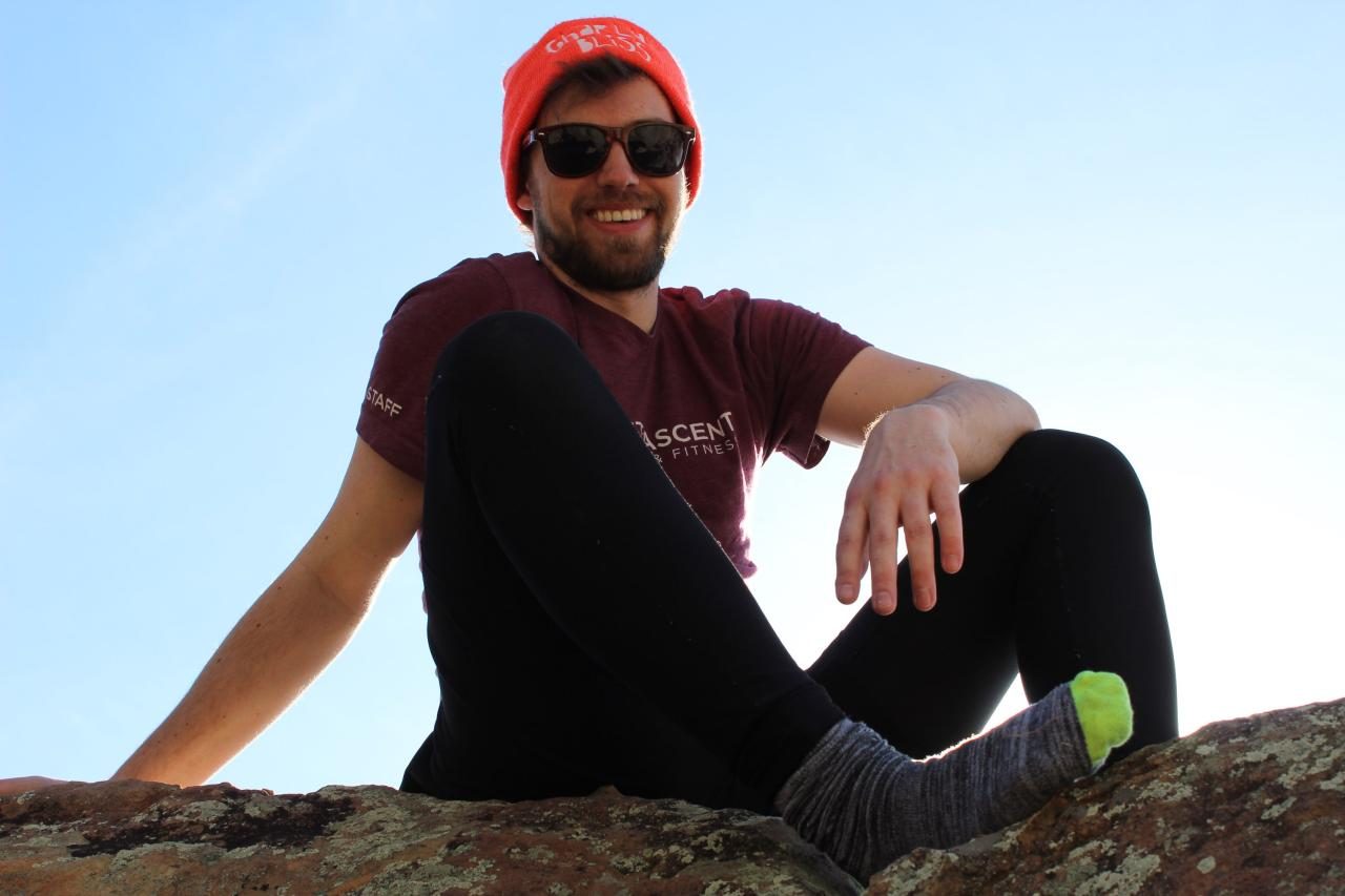 Glenn Sullivan in a First Ascent staff shirt on a climbing outing